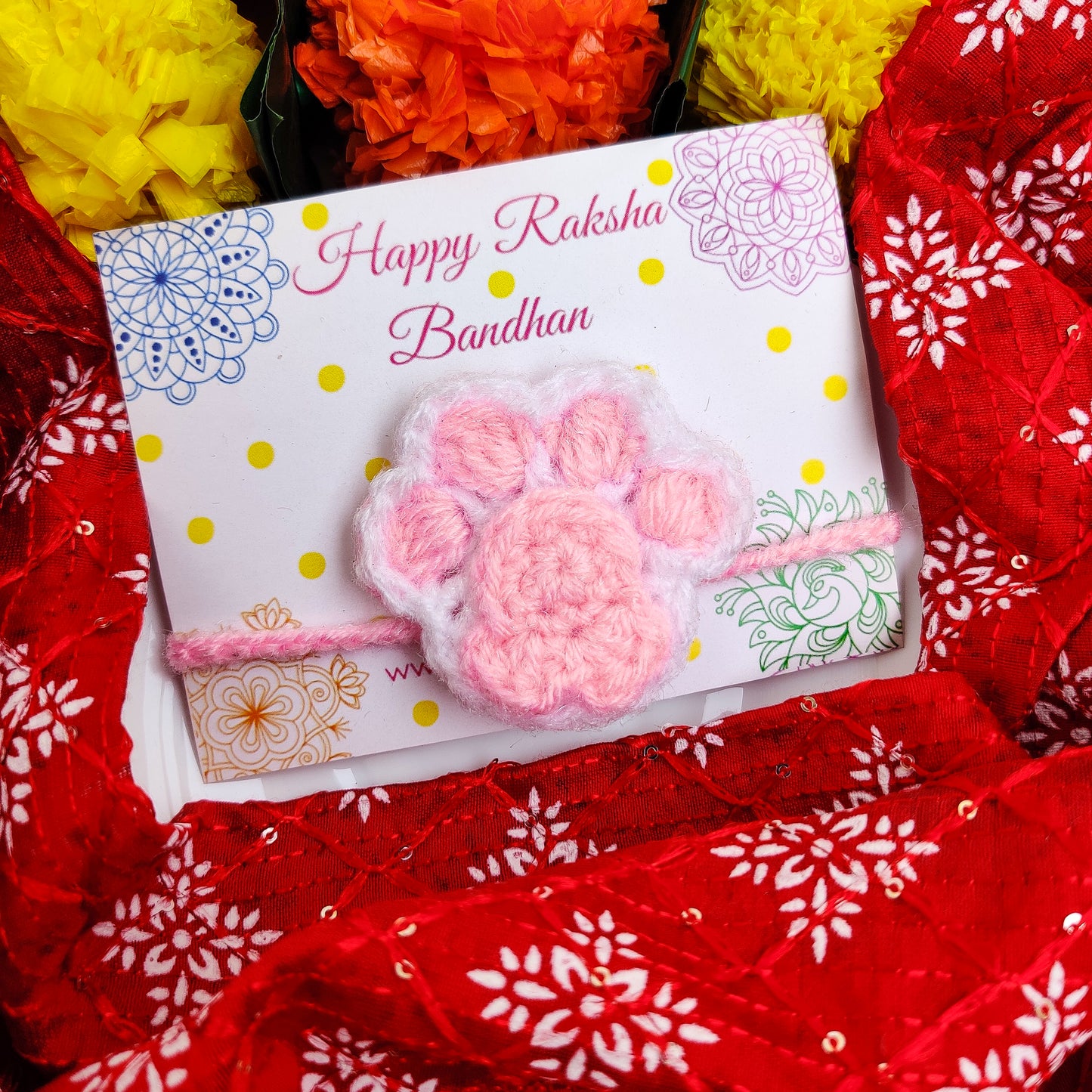 Crochet pink paw Rakhi